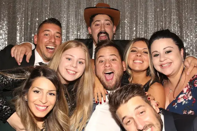 Guests celebrating in a photo booth at a GTA wedding