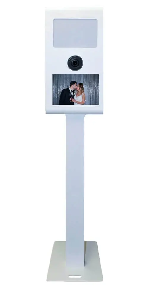 Sleek modern photobooth kiosk with a touch screen interface and high-quality camera, featuring a sample photo of a bride and groom kissing, ideal for weddings and special events, from Rent a PhotoBooth photobooth rentals.